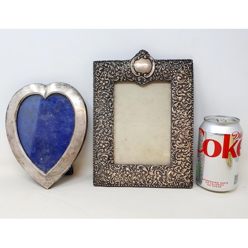 280 - A silver photograph frame, in the form of a heart, 18 x 13 cm, and another, rectangular, 23 x 16 cm ... 