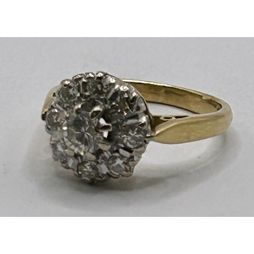 26 - An 18ct gold and diamond cluster ring, ring size H...