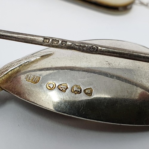 285 - A Victorian silver caddy spoon, a fruit knife, a Brandy label, a pickle fork, and a brooch in the fo... 