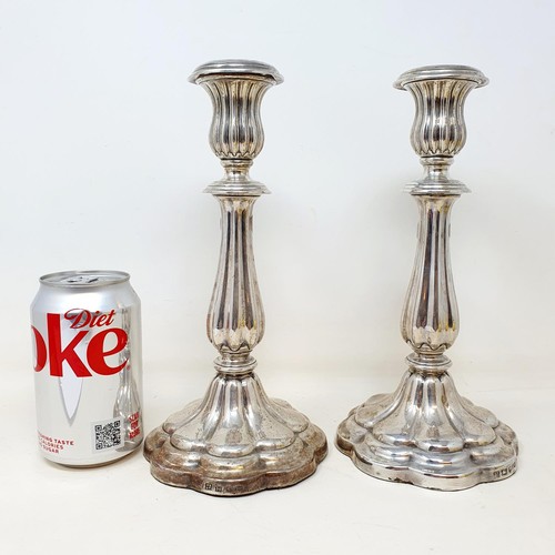 302 - A pair of early Victorian silver candlesticks, of lobed baluster form, Sheffield 1843, 24 cm high