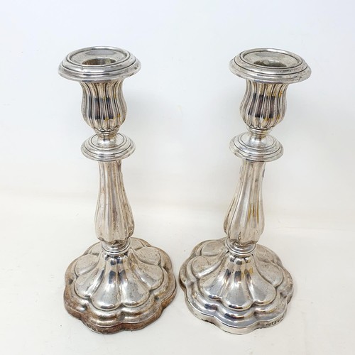 302 - A pair of early Victorian silver candlesticks, of lobed baluster form, Sheffield 1843, 24 cm high