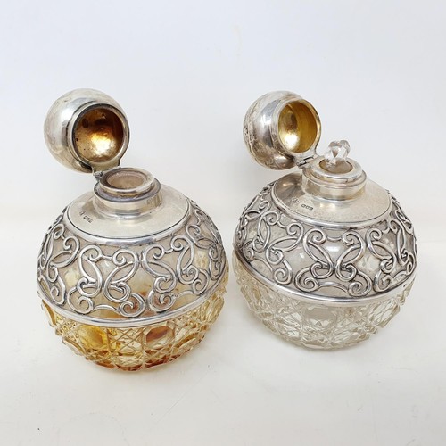 309 - A pair of Edward VII cut glass and silver mounted perfume bottles, London 1905, 12 cm high (2)