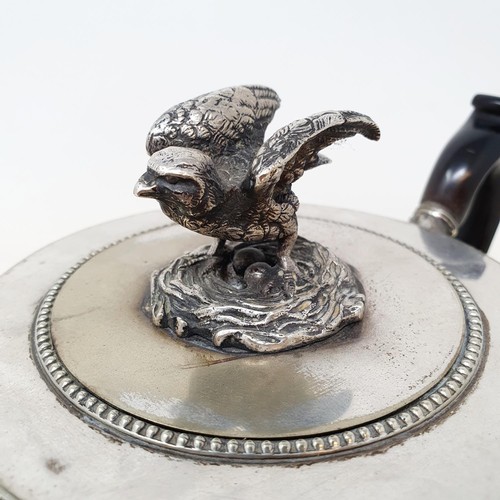 310 - A 19th century silver plated teapot, with a bird finial and an unusual set of dummy hallmarks