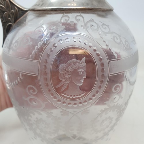 339 - A Victorian neo-classical style engraved/etched glass and silver claret jug, Sheffield 1875