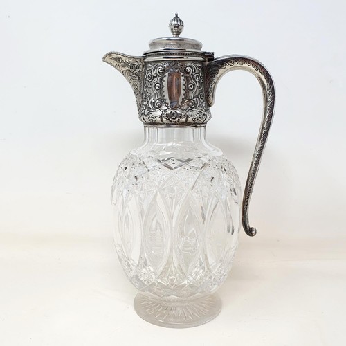 340 - A Victorian cut glass claret jug, with a silver mount