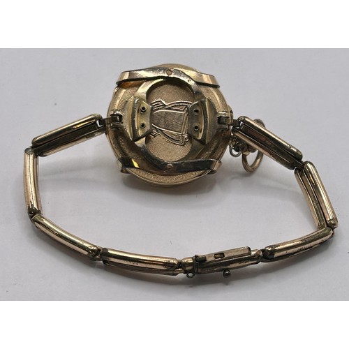 235 - A ladies gold pocket watch, converted to a wristwatch, on an expanding gold plated strap, cased