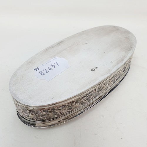 374 - A Dutch silver oval tobacco box, decorated a tavern scene, 15 cm wide