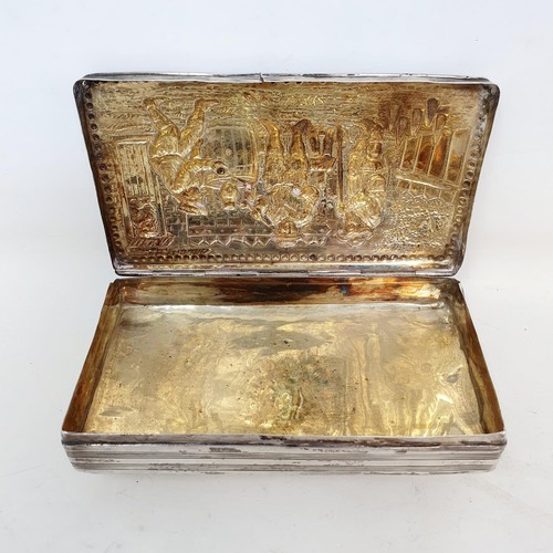 375 - A Dutch silver rectangular tobacco box, the lid decorated figures playing skittles, 13 cm wide