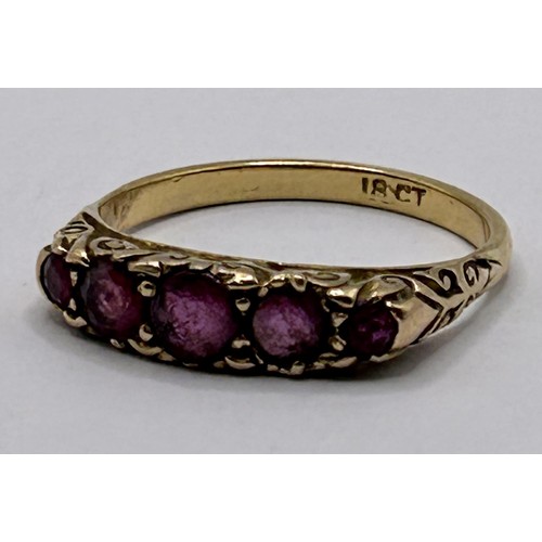 17 - An 18ct gold and garnet five stone ring, ring size Q...