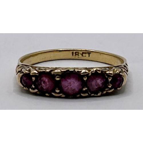 17 - An 18ct gold and garnet five stone ring, ring size Q...