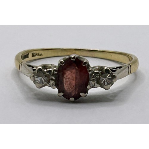 21 - A 9ct gold, garnet and diamond ring, ring size O...