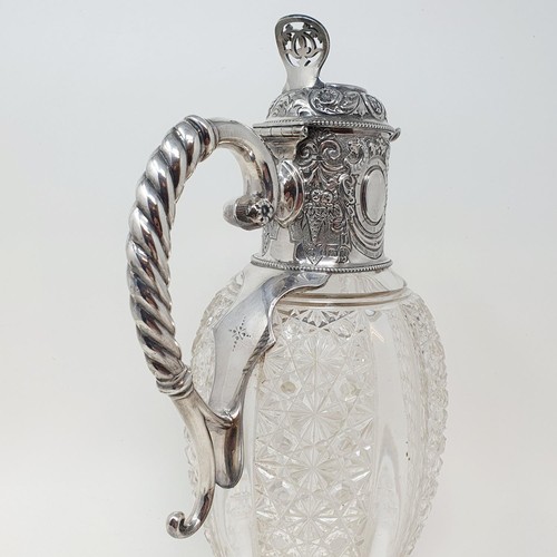 300 - A Victorian cut glass claret jug, with a silver mount and handle, Sheffield 1890, 28 cm high