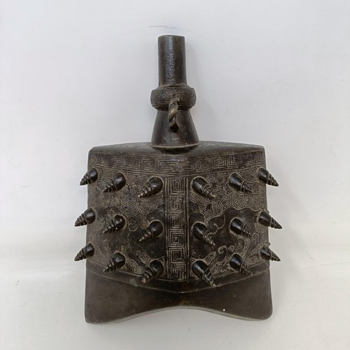 551 - A Chinese bronze altar bell, 20 cm high