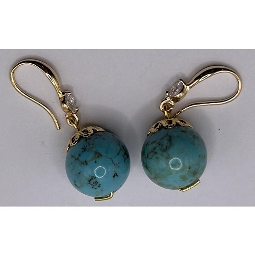 32 - A pair of turquoise and white stone earrings...