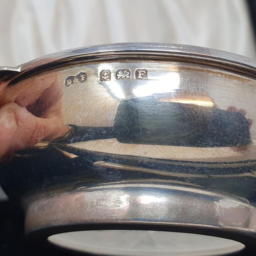 387 - A pair of George V silver pickle bowls, in the form of quaiches, with glass liners and matching fork... 