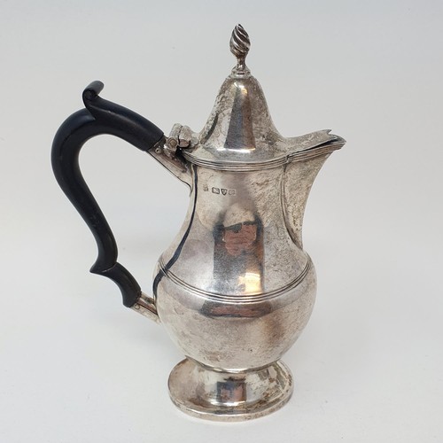 382 - A George V silver hot water jug, with an ebonised handle, Chester 1915, all in 7.6 ozt