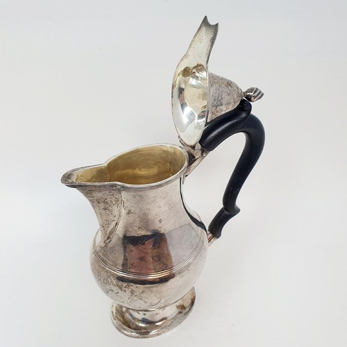 382 - A George V silver hot water jug, with an ebonised handle, Chester 1915, all in 7.6 ozt