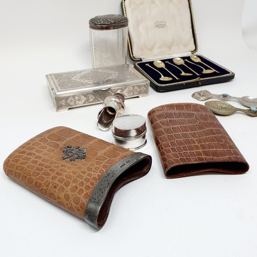 377 - A George V crocodile skin and silver mounted cigar case, a set of six silver teaspoons, two white me... 