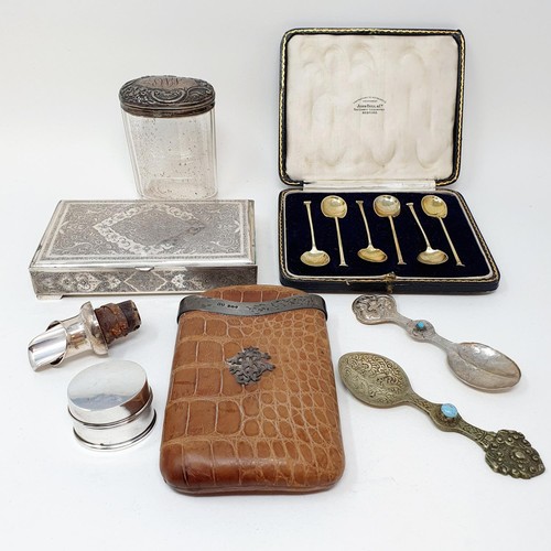 377 - A George V crocodile skin and silver mounted cigar case, a set of six silver teaspoons, two white me... 