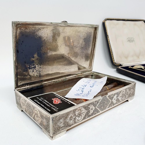 377 - A George V crocodile skin and silver mounted cigar case, a set of six silver teaspoons, two white me... 