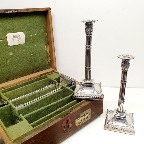 259 - A set of four George III silver candlesticks, in the form of cluster columns on a square base, with ... 