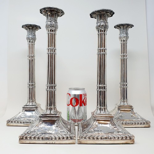 259 - A set of four George III silver candlesticks, in the form of cluster columns on a square base, with ... 