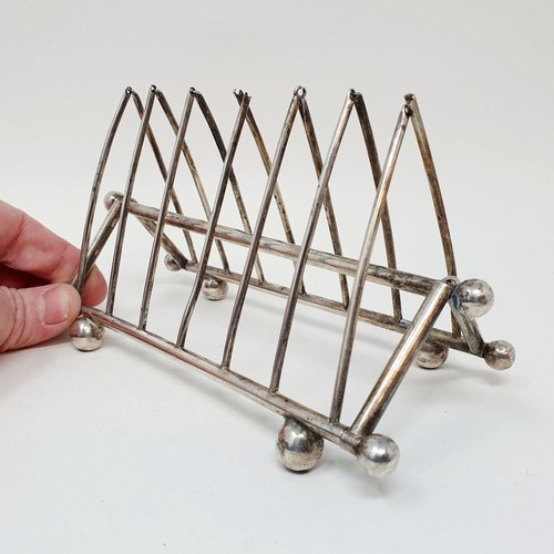 288 - An unusual Dr Christopher Dresser style folding five section toast rack