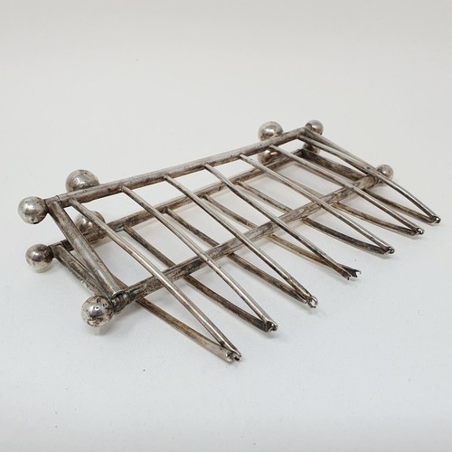 288 - An unusual Dr Christopher Dresser style folding five section toast rack