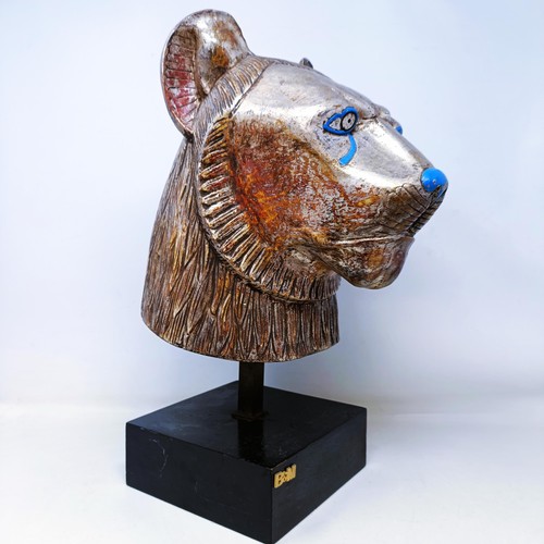 525 - A carved wood and gilt Egyptian style cat's head, mounted, 43 cm high