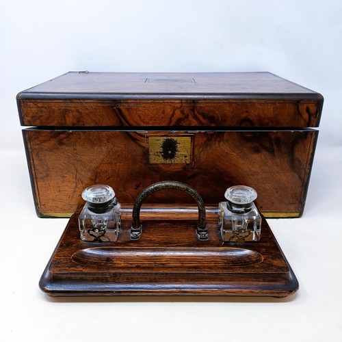 534 - A 19th century walnut writing slope, 41 cm, and an oak desk stand, 29 cm wide