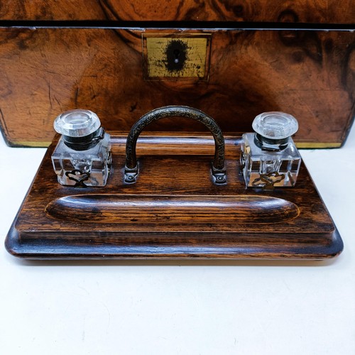 534 - A 19th century walnut writing slope, 41 cm, and an oak desk stand, 29 cm wide