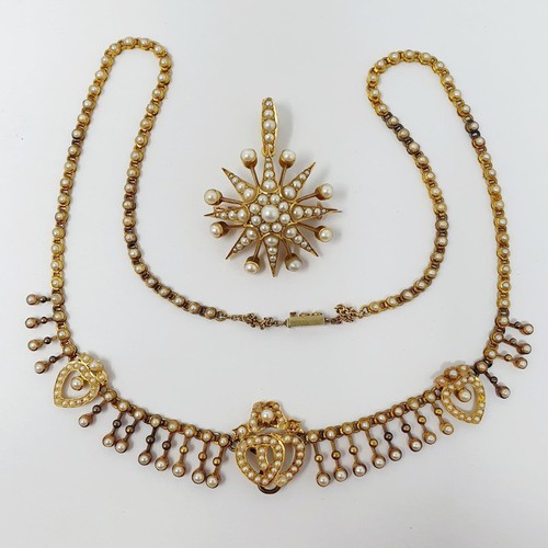 202 - A late 19th century yellow metal and seed pearl necklace, having a double heart motif, with a matchi... 