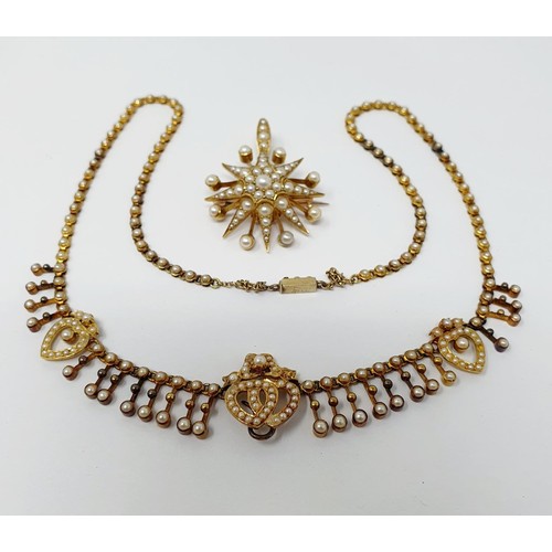 202 - A late 19th century yellow metal and seed pearl necklace, having a double heart motif, with a matchi... 