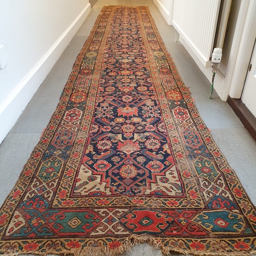 944 - A Persian blue ground runner, 500 cm x 79cm