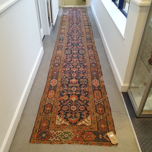 944 - A Persian blue ground runner, 500 cm x 79cm