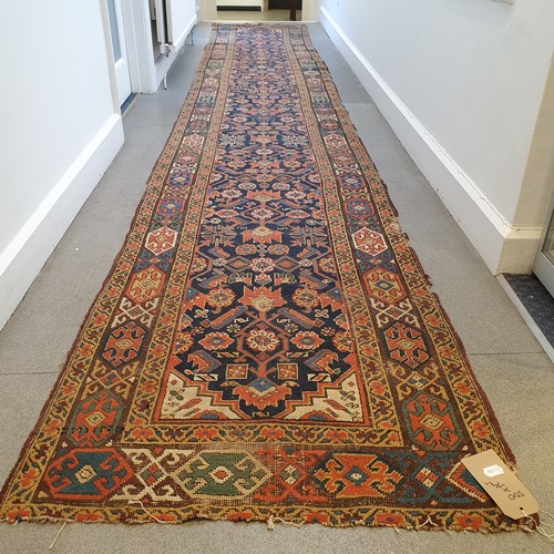 944 - A Persian blue ground runner, 500 cm x 79cm