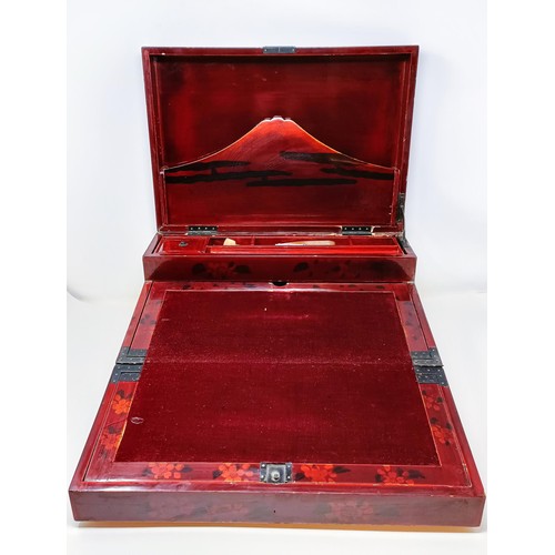 501 - A late 19th/early 20th century Japanese lacquered writing box, 40 cm wide