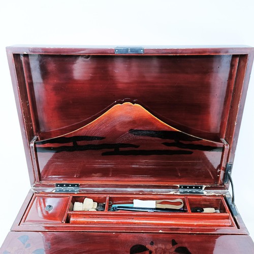 501 - A late 19th/early 20th century Japanese lacquered writing box, 40 cm wide