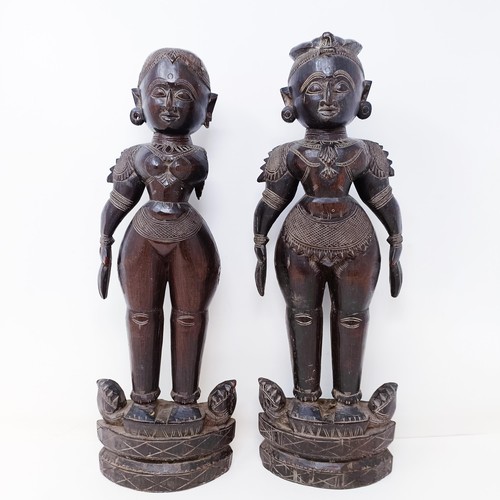 521 - A pair of carved wood Eastern figures, 40 cm high (2)