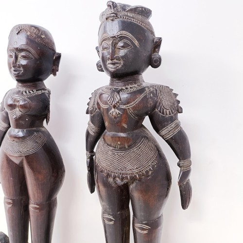 521 - A pair of carved wood Eastern figures, 40 cm high (2)