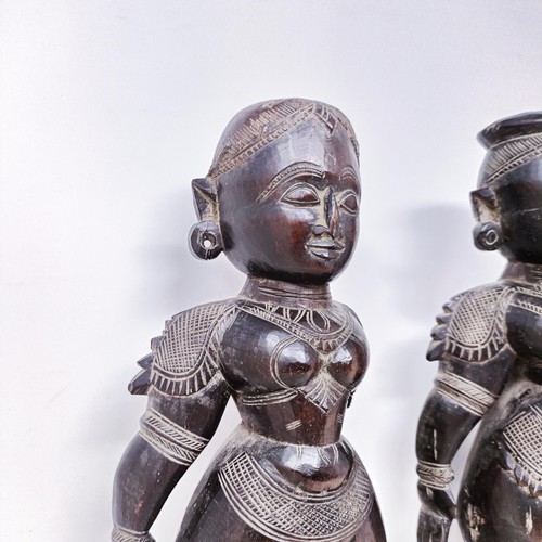 521 - A pair of carved wood Eastern figures, 40 cm high (2)