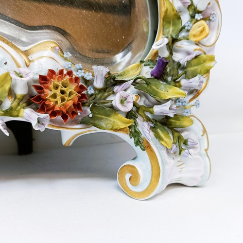 527 - A Dresden porcelain strut mirror, decorated flowers, 48 x 35 cm