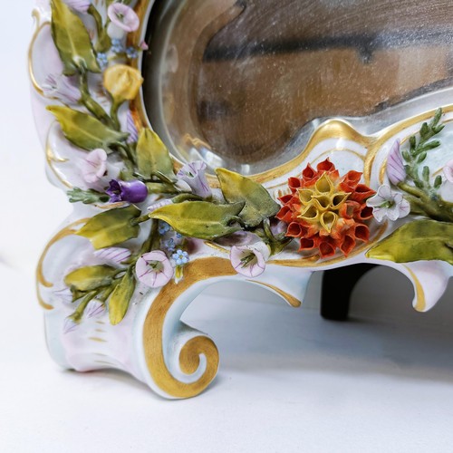 527 - A Dresden porcelain strut mirror, decorated flowers, 48 x 35 cm