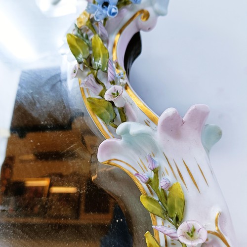 527 - A Dresden porcelain strut mirror, decorated flowers, 48 x 35 cm