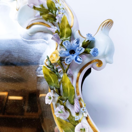 527 - A Dresden porcelain strut mirror, decorated flowers, 48 x 35 cm