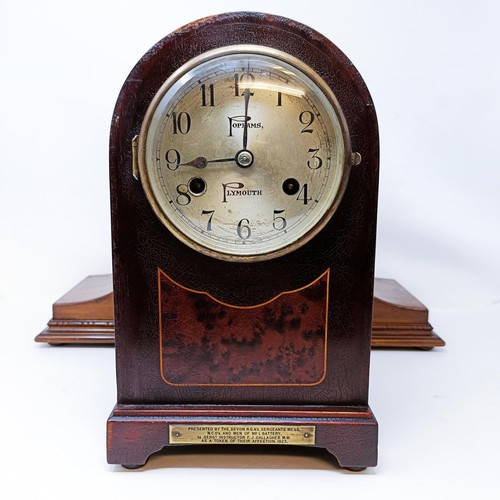 561 - A mantel clock, in a mahogany case, 34 cm high, and another (2)