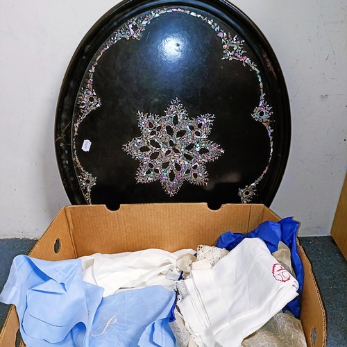 584 - A papier mache and mother of pearl oval tray, 73 x 59 cm, and assorted textiles (qty)