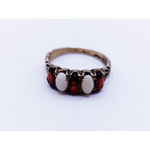 139 - An opal and garnet ring, ring size M