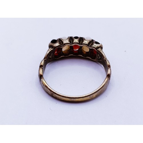 139 - An opal and garnet ring, ring size M