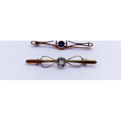 141 - An aquamarine and seed pearl bar brooch and two other bar brooches (3)